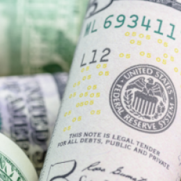 Money highlighting The Federal Reserve