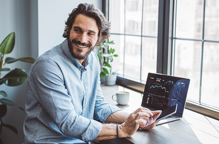 man sitting at computer