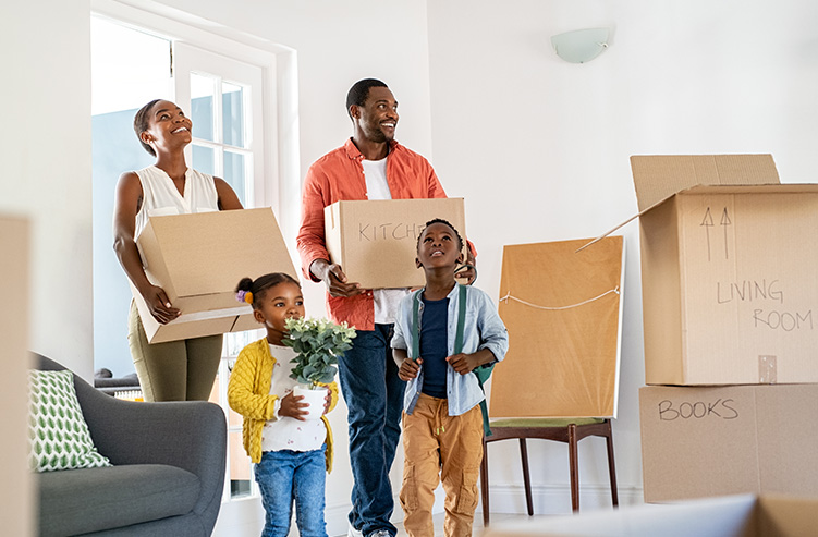 family walking into new home