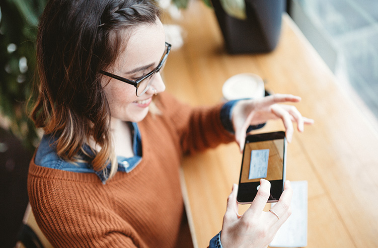 lady depositing check with phone